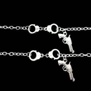 PARTNERS IN CRIME BRACELETS X2 HANDCUFFS GUN